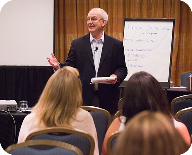 Consulting/Facilitating Hardy speaking to a crowd